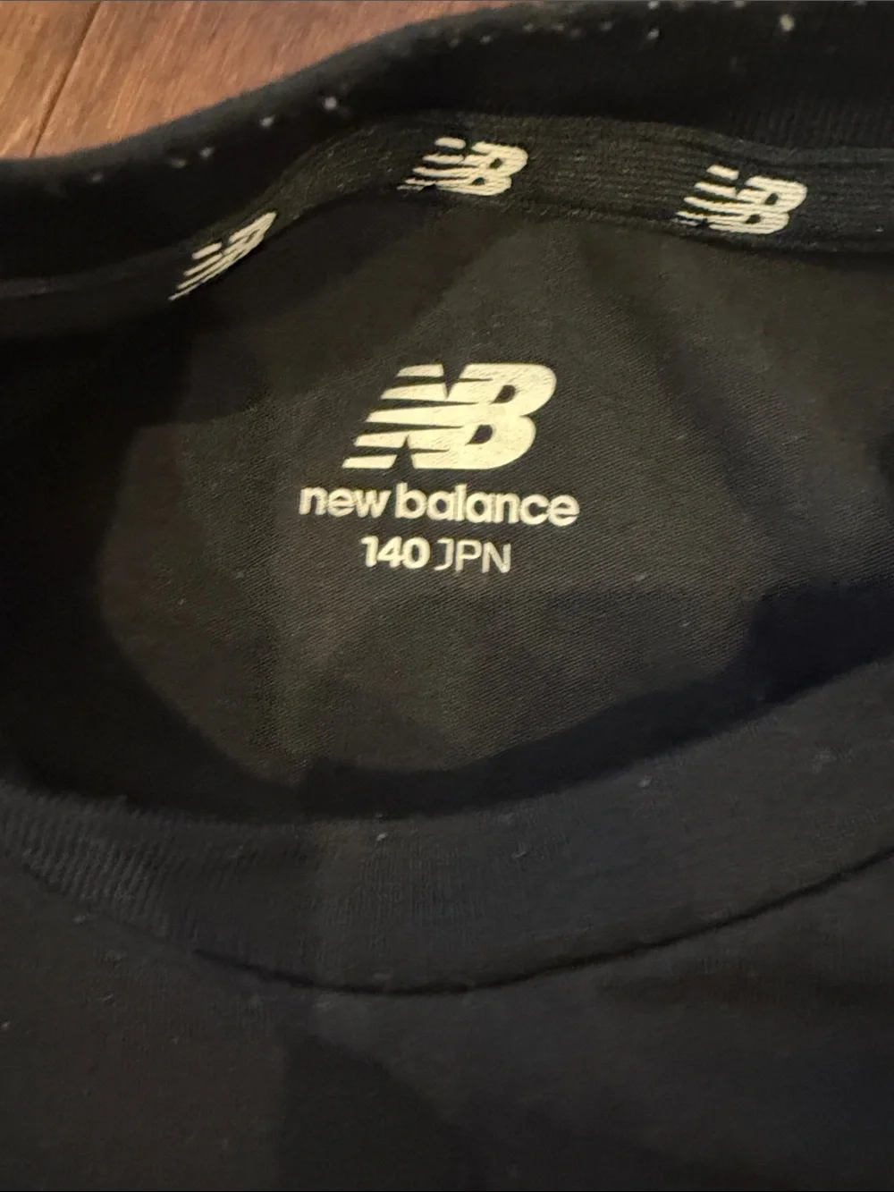 New Balance Black Tee with Red Sneaker Space Graphic